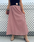 Put Me In Crimson Gingham Maxi Skirt styled with a black strapless top and suede boots, perfect for a classic gameday look.