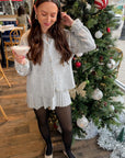 Livia Grey Button Up Sweater Skirt Set styled for the holidays with black tights and flats, perfect for festive winter gatherings.