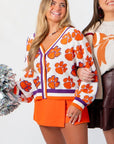 Queen of Sparkles Clemson Mascot Rhinestone Cardigan with orange tiger paw rhinestones, styled for game day with cheer accessories.