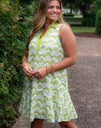 Sleeveless Emily Chartreuse Abstract Collared Dress featuring vibrant green floral patterns and a flared hem for a stylish, standout look.