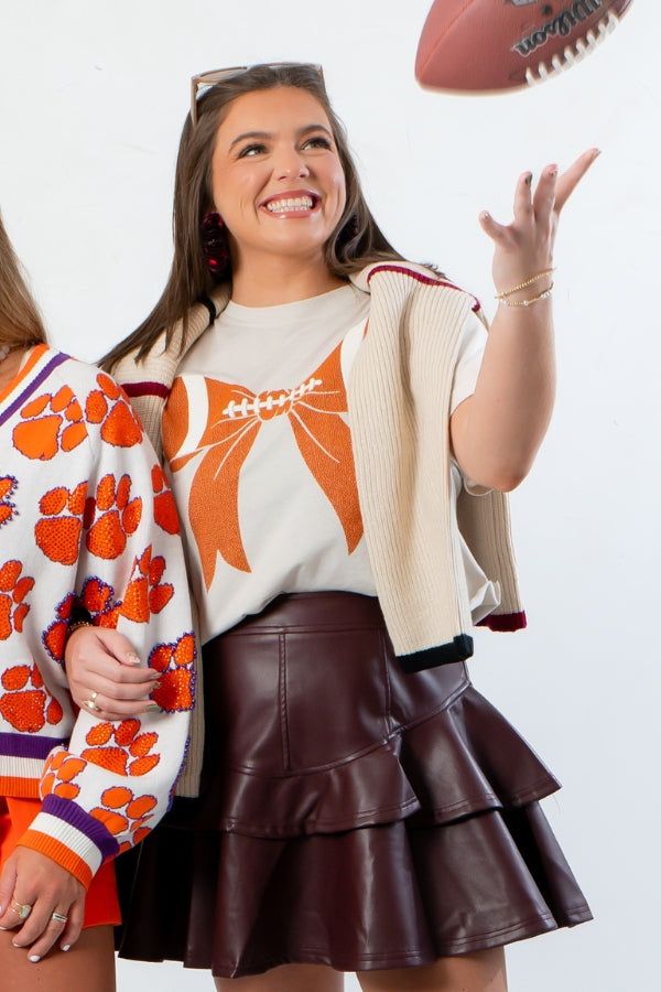 Goal Line Football Tee - Bone Bow Crop Tshirt styled for game day with maroon leather skirt and layered cardigan, perfect for sporty fashion fans.