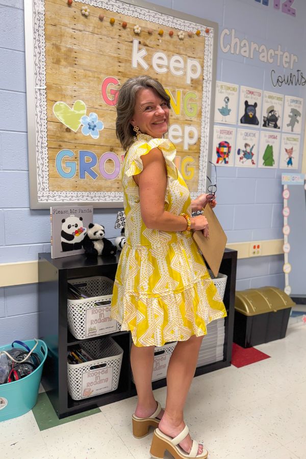 Back view of Better In Yellow Tiered Ruffle Sleeve Mini Dress showing flowy layers and playful silhouette, ideal for school or casual outings.