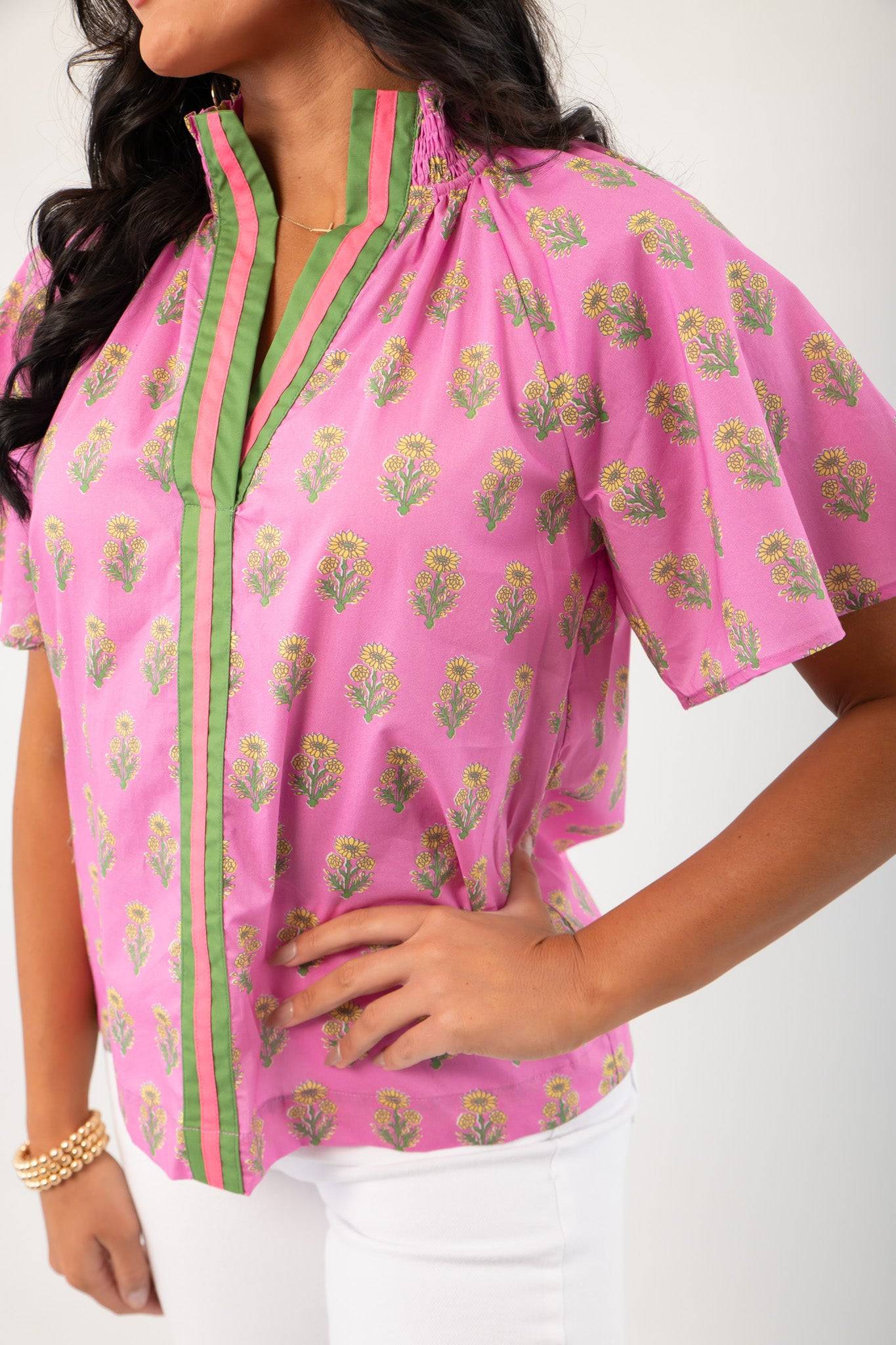 THML Pink Floral Smocked Neck Top with green-trimmed V-neckline and short sleeves, perfect for spring fashion in women's clothing tops.