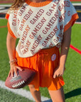 Close-up of GAMEDAY Orange & White Sequin Sweater Vest featuring bold text design. Ideal for summer tailgates and school spirit events.