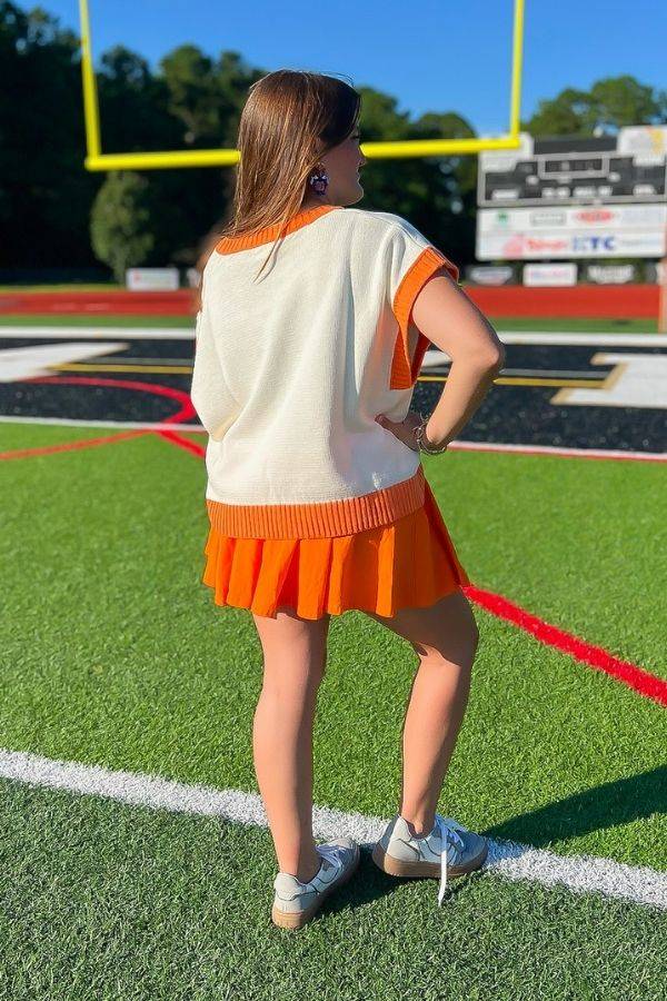 Back view of GAMEDAY Orange & White Sequin Sweater Vest showing contrast trim. Lightweight collegiate vest for summer and sports events.