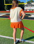 Back view of GAMEDAY Orange & White Sequin Sweater Vest showing contrast trim. Lightweight collegiate vest for summer and sports events.