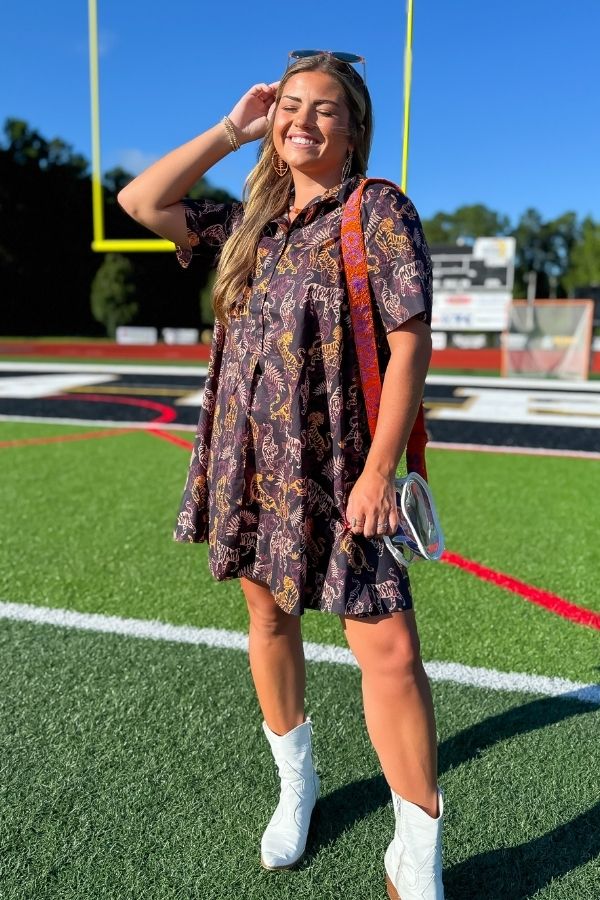 Tiger Printed Button Down Mini Dress – Gameday Shirt Dress styled with white boots on a football field, perfect for tailgating and casual gameday looks.