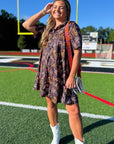 Tiger Printed Button Down Mini Dress – Gameday Shirt Dress styled with white boots on a football field, perfect for tailgating and casual gameday looks.