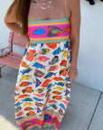 Front view of Show Me Your Mumu Rainbow Reef Skylar Maxi Dress featuring vibrant multicolor fish pattern and strapless flowy design.