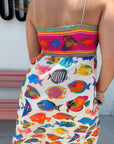 Back detail of Show Me Your Mumu Rainbow Reef Skylar Maxi Dress showcasing smocked bodice and vivid aquatic-themed print.