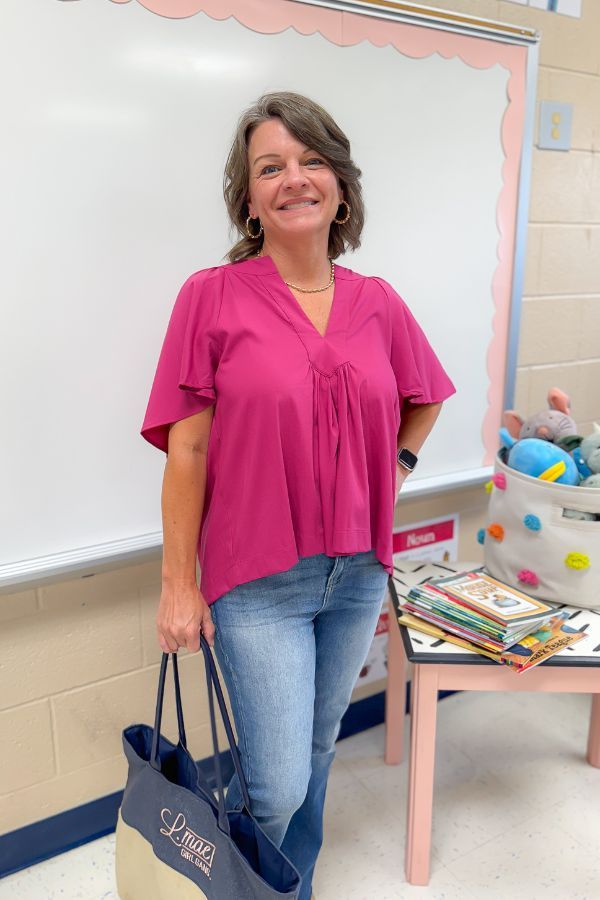 Very Berry Tunic Top - Pinch Pleated paired with denim, showcasing its flattering V-neck and pleated front, great for work or casual outings.