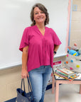 Very Berry Tunic Top - Pinch Pleated paired with denim, showcasing its flattering V-neck and pleated front, great for work or casual outings.