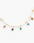 Close-up of the All Mine Colorful Heart Charm Necklace showcasing multicolor heart-shaped cubic zirconia charms on a delicate gold-plated chain.