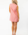 Back view of Poppy Red Gingham Mini Dress showing its clean, sleeveless cut and lightweight fabric for warm weather comfort.