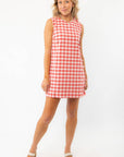 Model wearing Poppy Red Gingham Mini Dress with platform sandals, perfect for casual summer events and daytime outings.