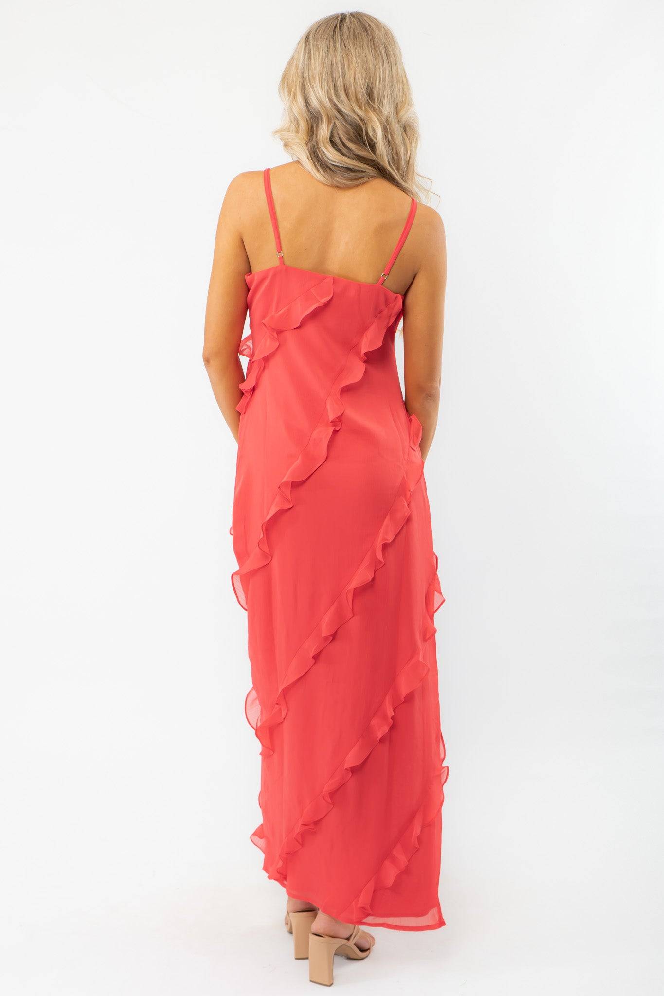 Back view of the MINKPINK Red Ruffle Maxi Dress showcasing delicate spaghetti straps and cascading ruffles for a sophisticated evening outfit.