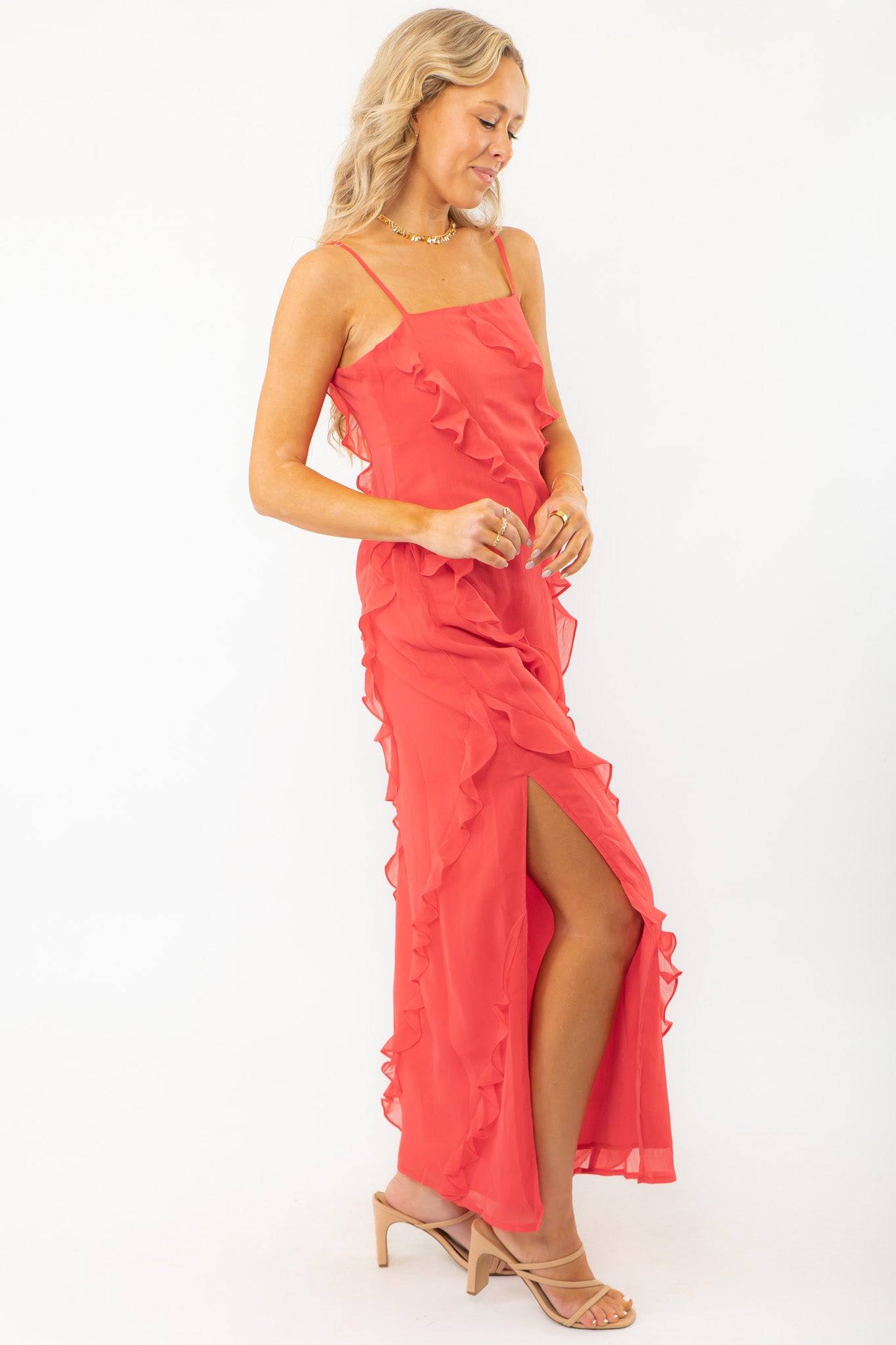 MINKPINK Red Ruffle Maxi Dress featuring a thigh-high side split and flowing ruffle details, perfect for special occasions and wedding guest attire.
