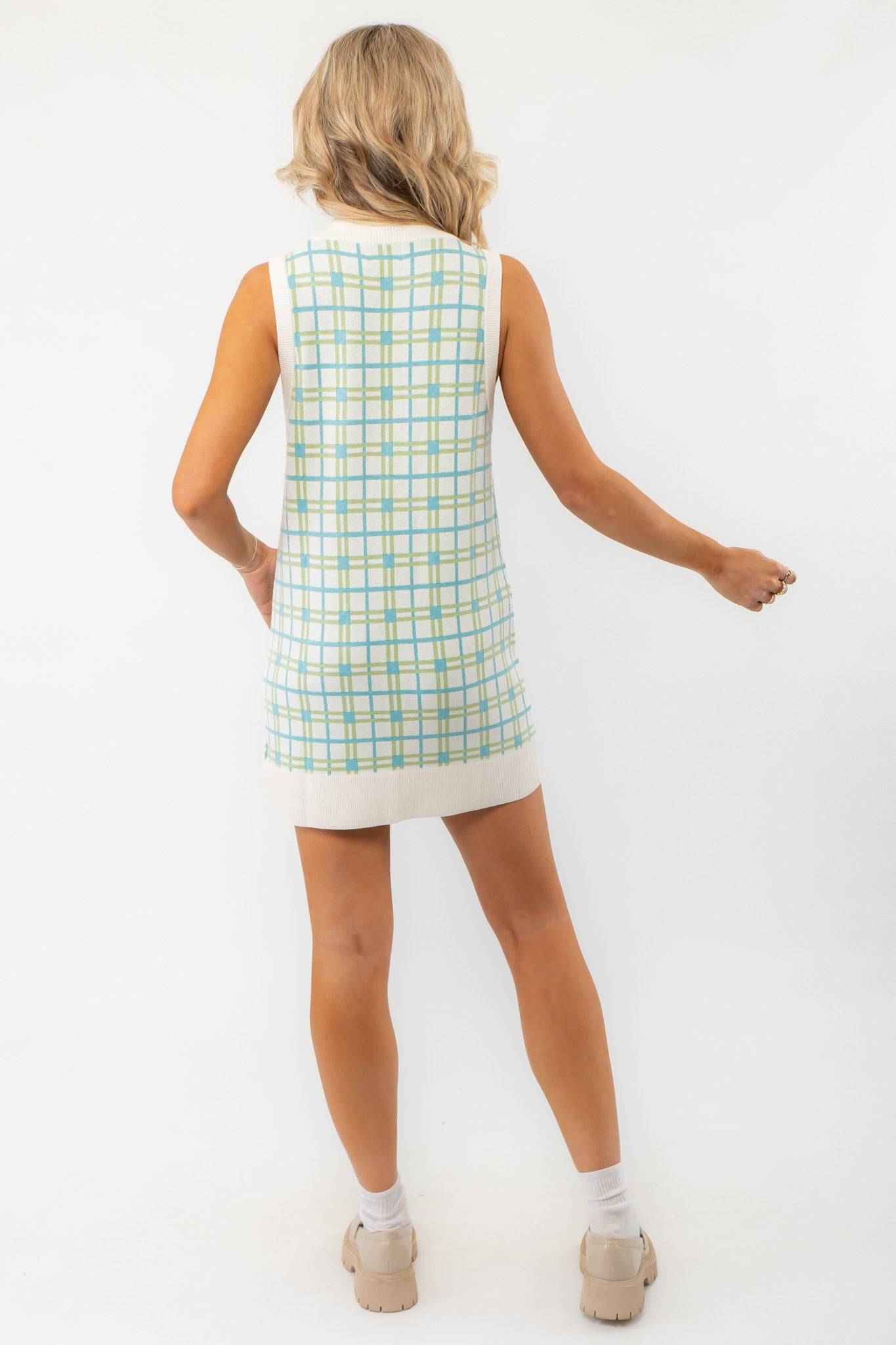 Back view of the Show Me Your Mumu Green Plaid Knit Hartford Tank Sweater Dress, showcasing its sleeveless design and ribbed hem.