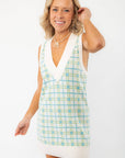 Close-up of the Show Me Your Mumu Green Plaid Knit Hartford Tank Sweater Dress, featuring a deep V-neckline and preppy plaid pattern.