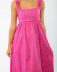 Close-up of the Show Me Your Mumu Pink Shells Fling Midi Dress, showcasing its ruched straps, square neckline, and intricate tropical print.