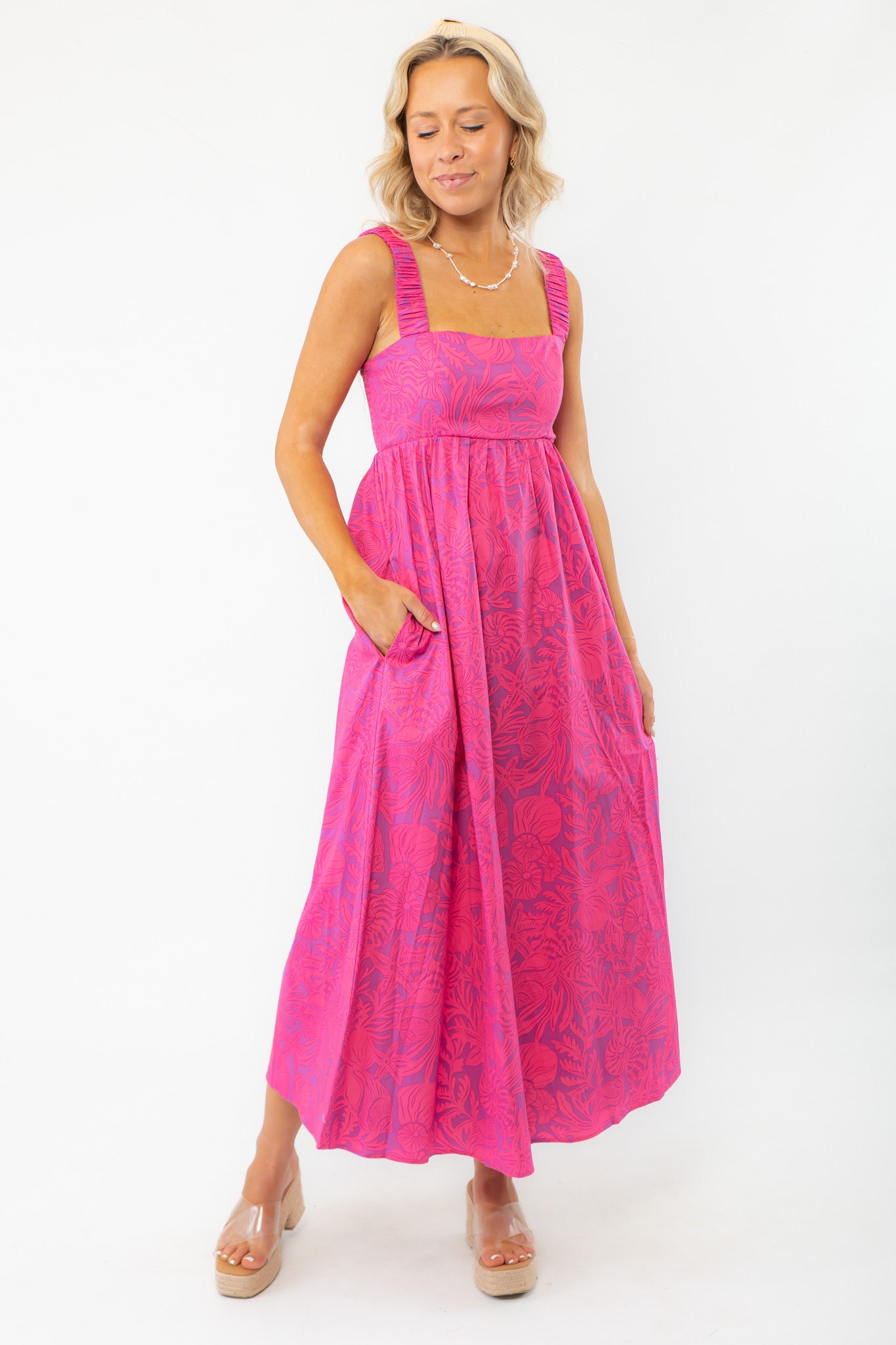 Show Me Your Mumu Pink Shells Fling Midi Dress featuring a vibrant pink tropical print, smocked back, and elastic straps for a comfortable fit.