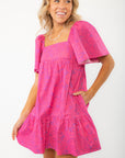 Vibrant pink Erin Mini Dress by Show Me Your Mumu featuring a tropical print, square neckline, and side pockets for a chic summer look.