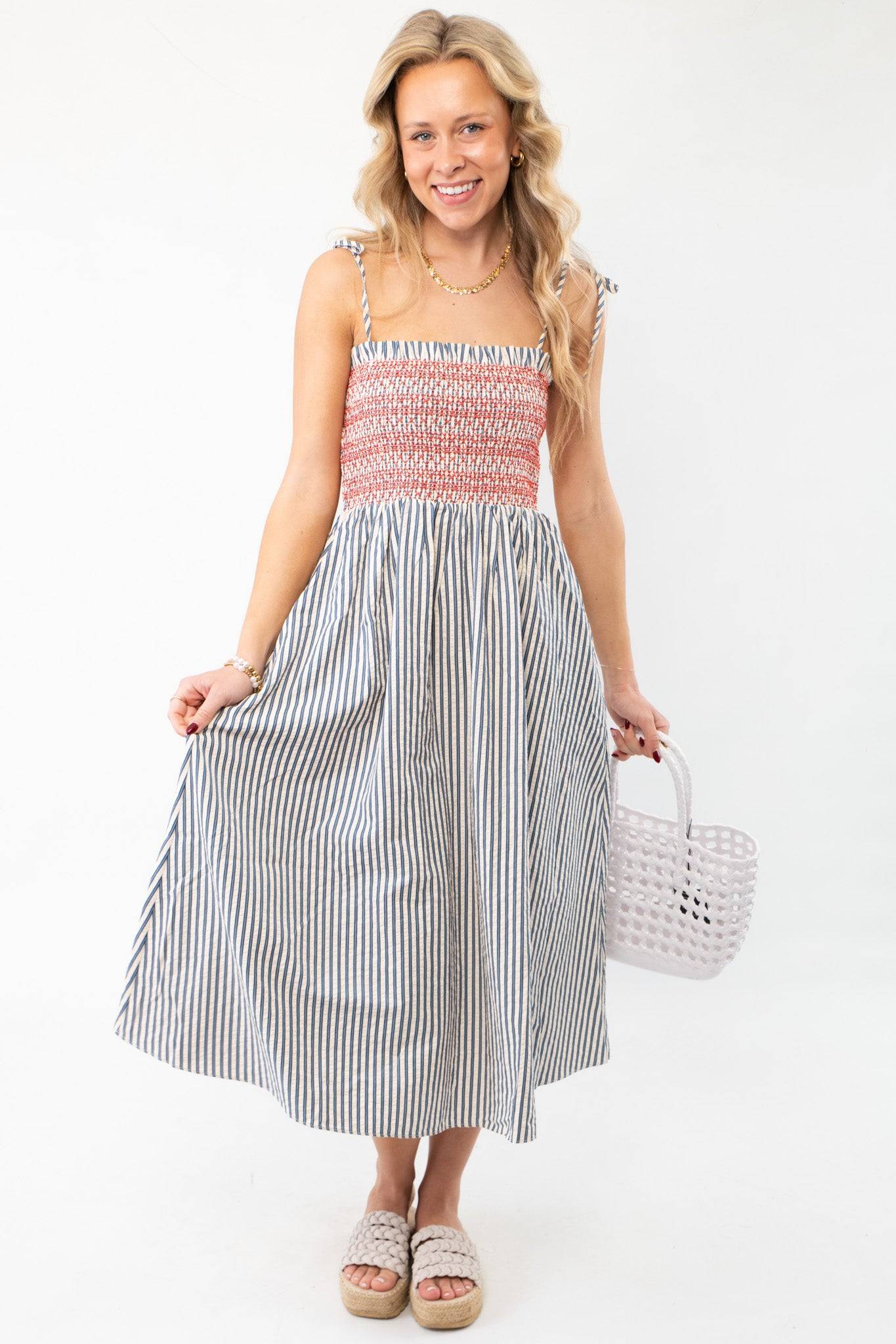 THML Smocked Blue Striped Tie Strap Midi Dress - Casual Chic, featuring a red smocked bodice and flowy striped skirt, ideal for summer outings.