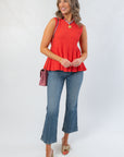 Papaya Flared Rib Knit Top styled with jeans and heels, featuring a sleeveless peplum silhouette and textured ribbed fabric for a chic fall look.
