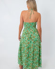 Back view of green and pink floral maxi dress with halter neckline