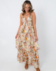 Back view of floral tiered maxi dress with adjustable straps
