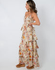 Side profile of floral wildflower tiered maxi dress with ruffles