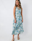 Back view of Watercolor Nymphéas Blue Floral Midi Dress with V-back and watercolor floral print, perfect for occasion wear