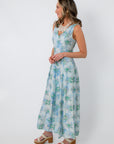 Side view of Watercolor Nymphéas Blue Floral Midi Dress with watercolor floral print, styled for spring events