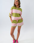 Casual pink and green striped outfit perfect for summer travel