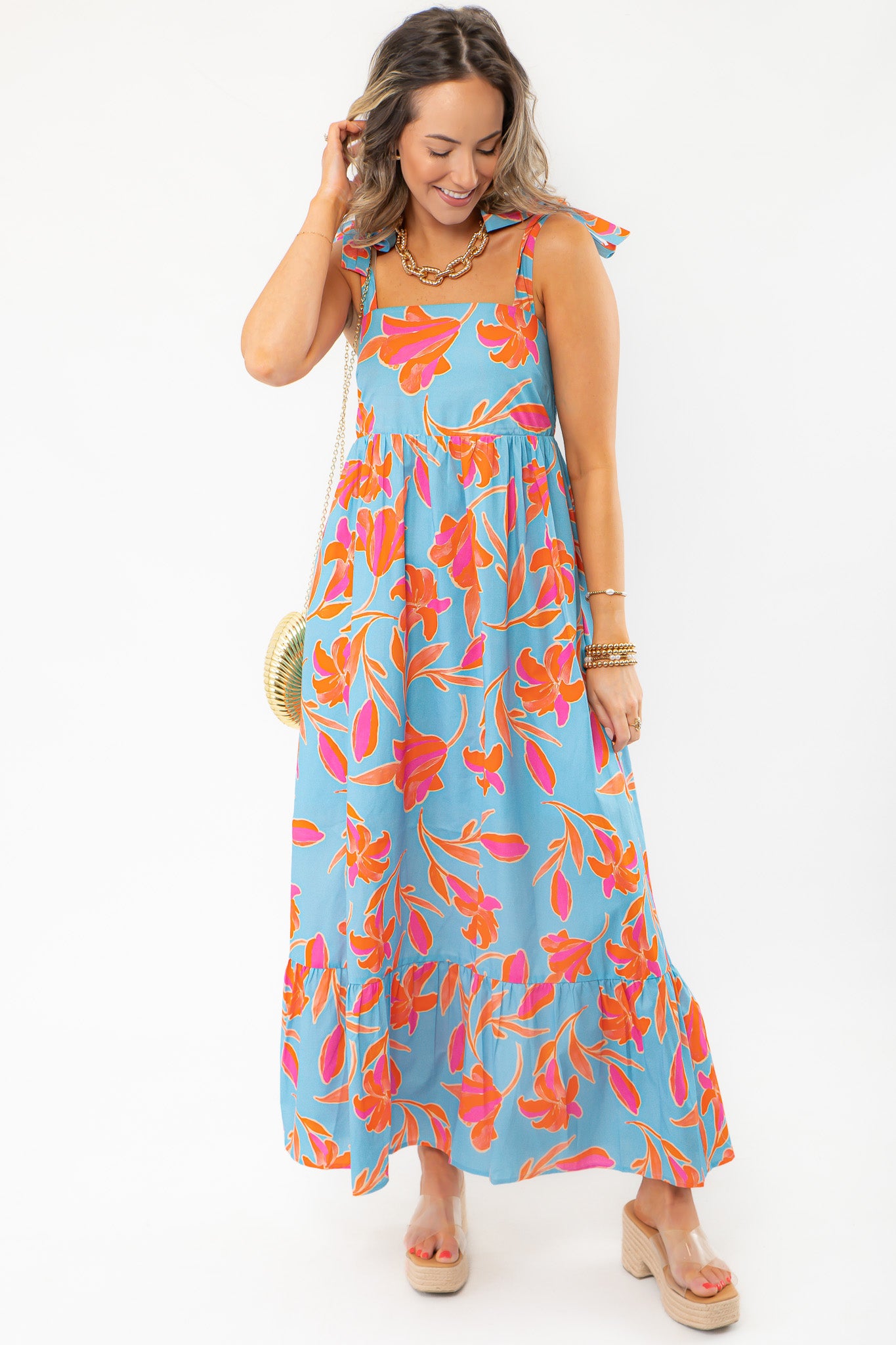 THML Tie Strap Flower Print Maxi Dress in blue with vibrant orange and pink floral pattern, perfect for beach vacations and summer outings.