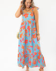 THML Tie Strap Flower Print Maxi Dress in blue with vibrant orange and pink floral pattern, perfect for beach vacations and summer outings.
