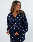 Comfortable navy hooded sweatshirt with zip and pockets paired with matching navy polka dot shorts