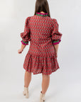 Back view of Mulberry Mistletoe Block Print Dress highlighting the festive block print and gathered skirt detail for a cheerful holiday look.