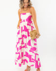 Meet Me in Santorini Fuchsia Wave Maxi Dress with on-seam pockets and bright abstract print, ideal for vacation and summer style.