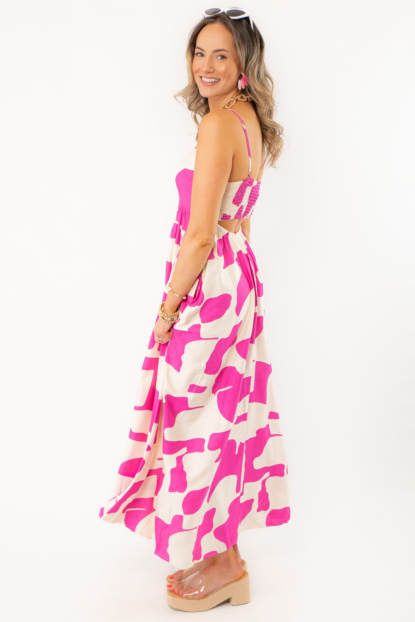 Side view of Meet Me in Santorini Fuchsia Wave Maxi Dress highlighting its relaxed fit and breezy fabric for beach-ready elegance.