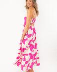 Side view of Meet Me in Santorini Fuchsia Wave Maxi Dress highlighting its relaxed fit and breezy fabric for beach-ready elegance.