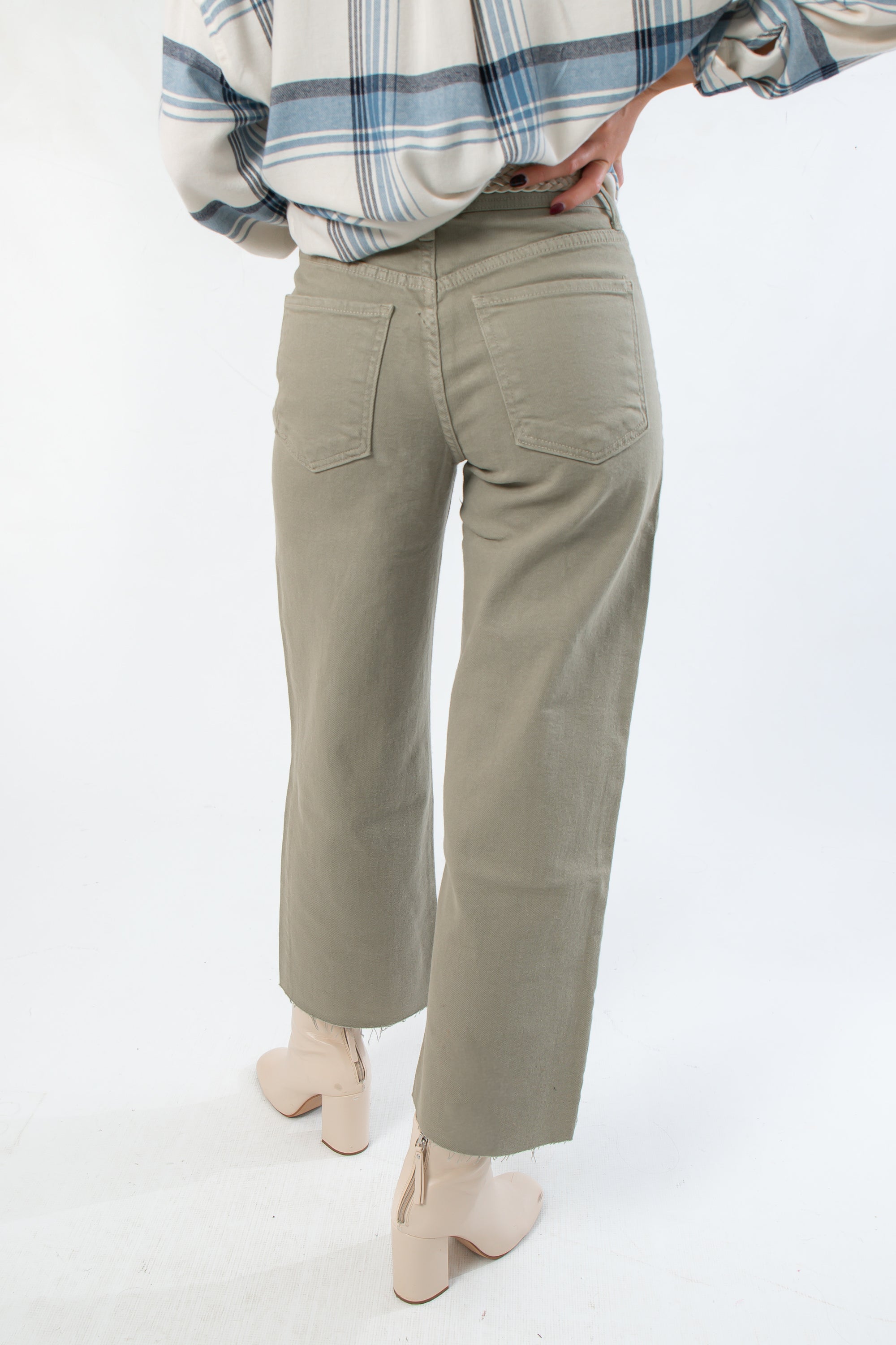 Back view of Rosemary Utility Wide Leg Jeans featuring back patch pockets and cropped wide leg design in soft faded green denim.