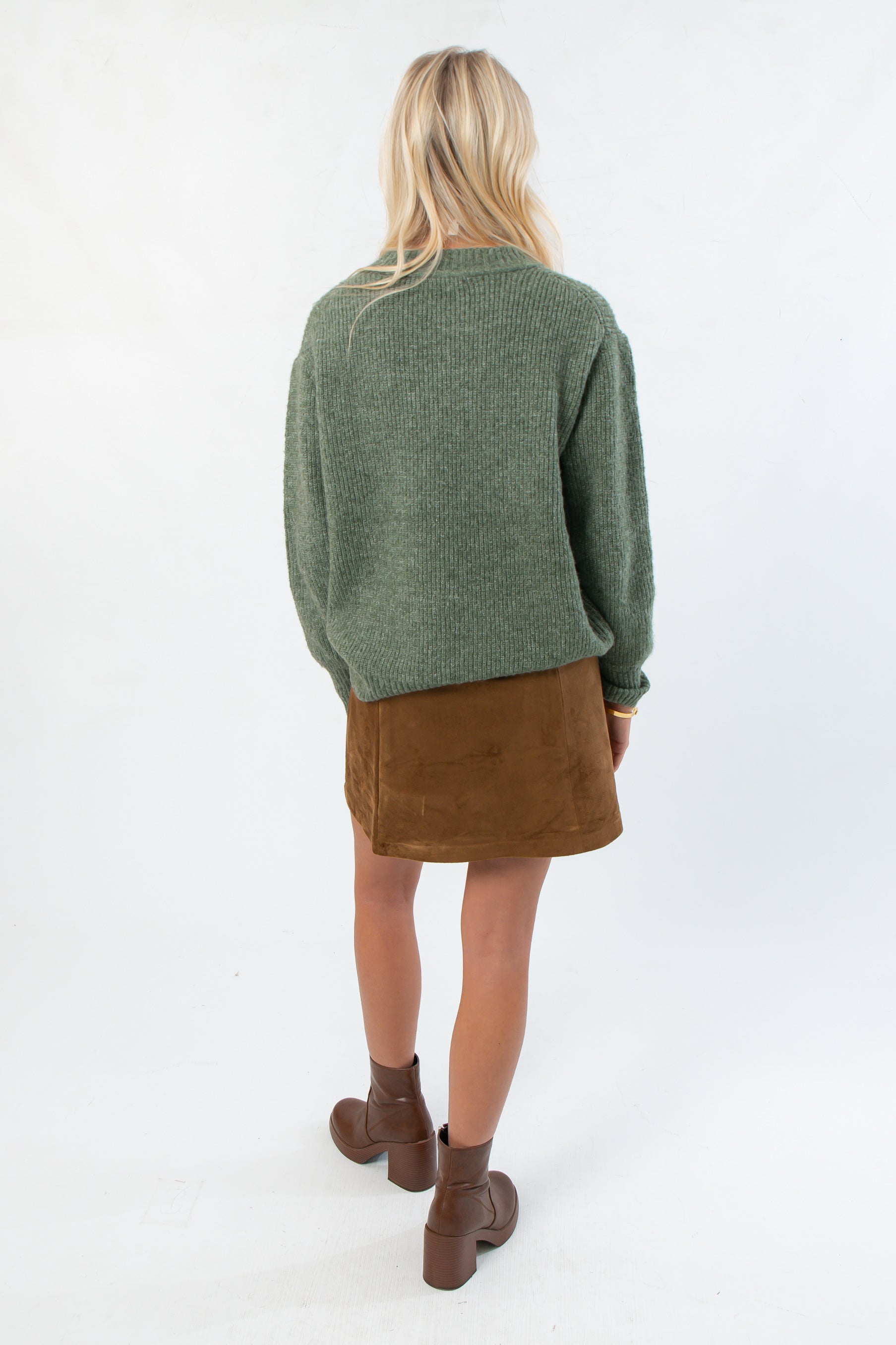 Back view of Dark Sage Ribbed Crewneck Sweater showing relaxed fit and ribbed texture, great for casual fall fashion.