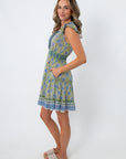 Back view of Alicia Lagoon Blockprint Sleeveless Mini Dress showing floral pattern and smocked waist