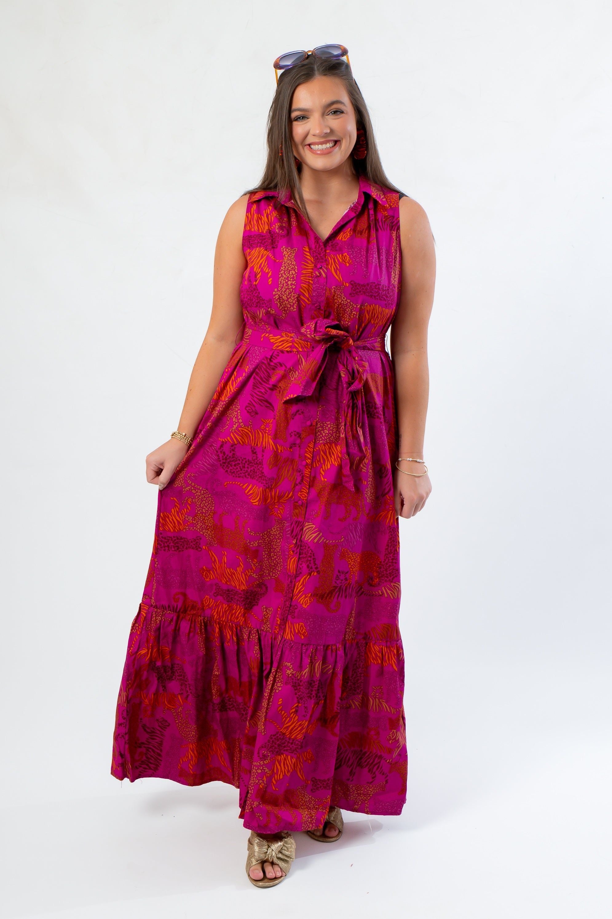 Cileah Jungle Dress in magenta with sleeveless maxi design, featuring a belted waist and tiered skirt, ideal for vibrant gameday looks.