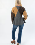 Back view of Steve Madden Argyle Lillie Cardigan highlighting flared peplum bottom and large argyle knit pattern on the back.