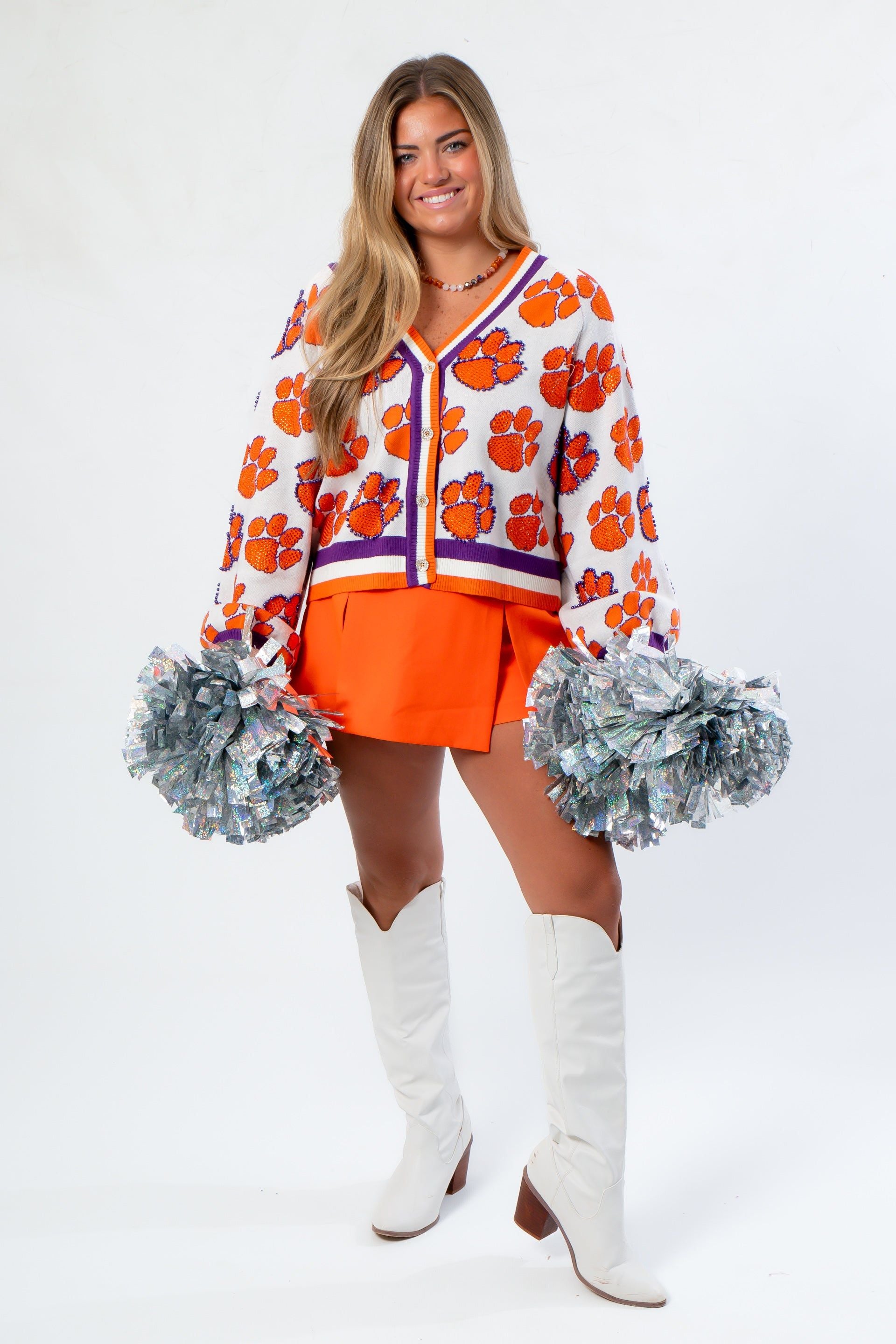 Game Day Chic in Queen of Sparkles Clemson Mascot Rhinestone Cardigan, featuring bold tiger paw rhinestones and oversized fit.