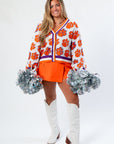 Game Day Chic in Queen of Sparkles Clemson Mascot Rhinestone Cardigan, featuring bold tiger paw rhinestones and oversized fit.