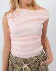 Friday Feeling Baby Pink Asymmetrical Knit Top with off-shoulder design, styled with leopard print drawstring pants. Lightweight spring knit top.