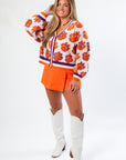 Queen of Sparkles Clemson Mascot Rhinestone Cardigan styled with orange skort and white boots, perfect for spirited game day looks.